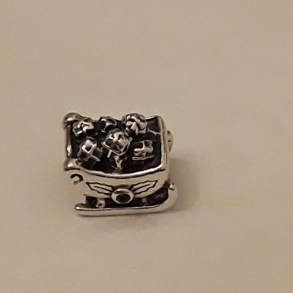 Pandora retired Santa's Sleigh with Garnet stones  925 ALE